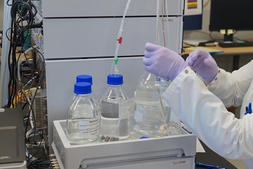 Person using laboratory equipment to test for PFAS