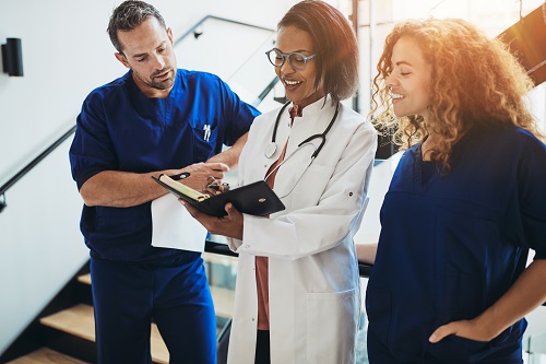 Health care providers looking at patient charts