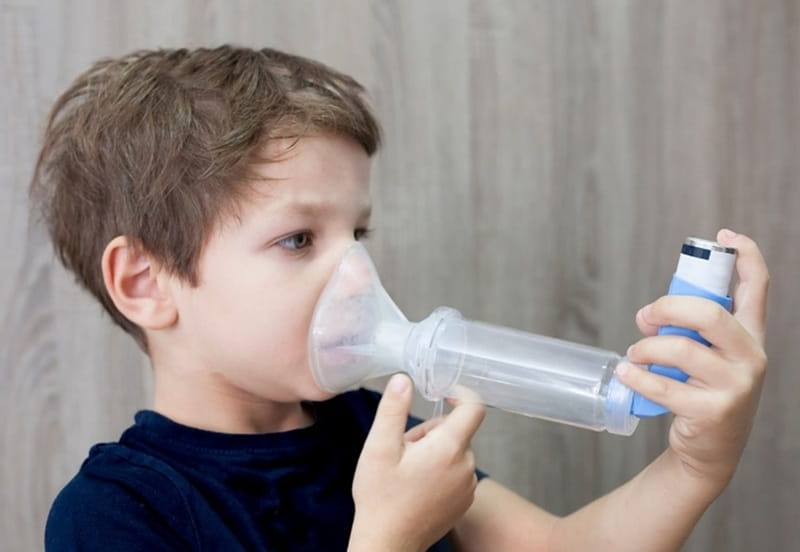 Child with asthma inhaler