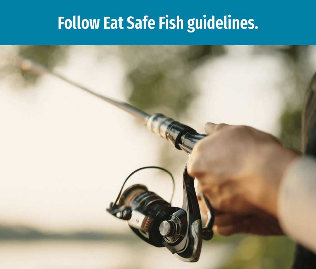 Closeup of hands holding a fishing reel. Text reads Follow eat safe fish guidelines.