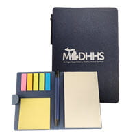 Notebook with sticky notes and the MDHHS logo on the cover