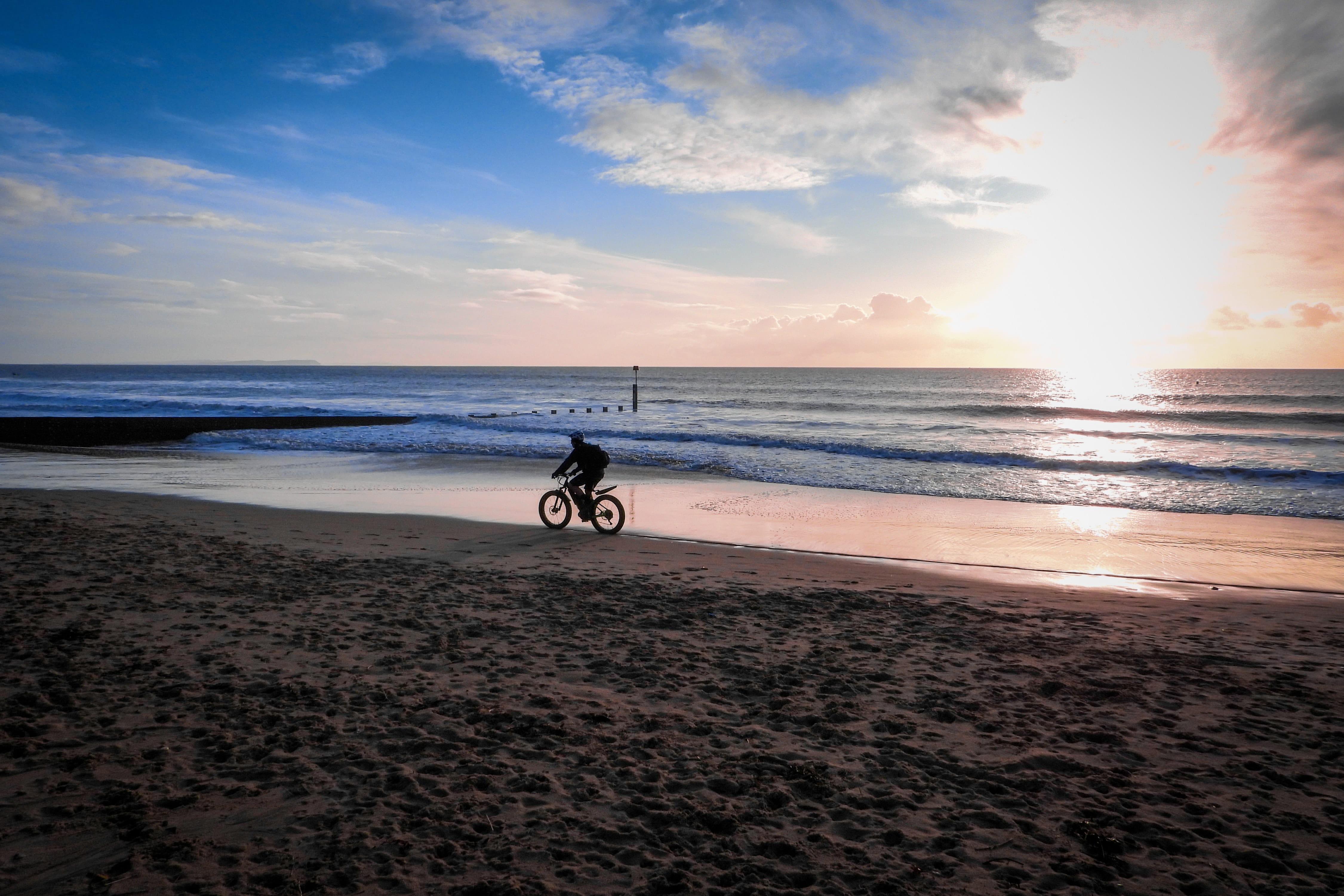 Photo of a bicyclist riding along the lakeshore.