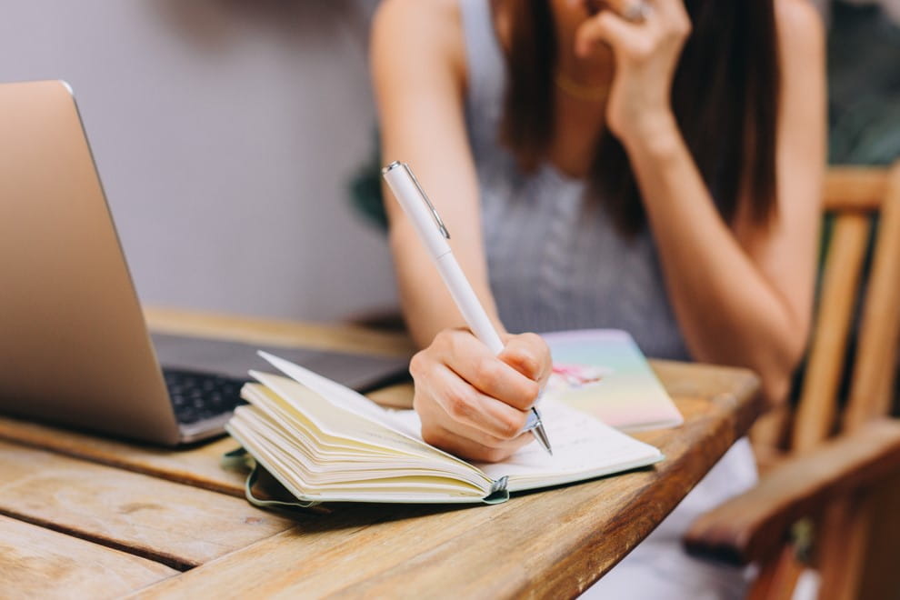 girl writing in notebook