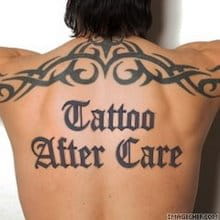 Image of a back with a tattoo reading "Tattoo After Care"