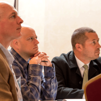 Three gentlemen in a meeting