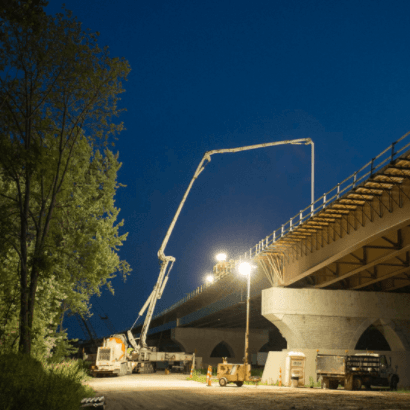 Concrete being pumped onto bridge 