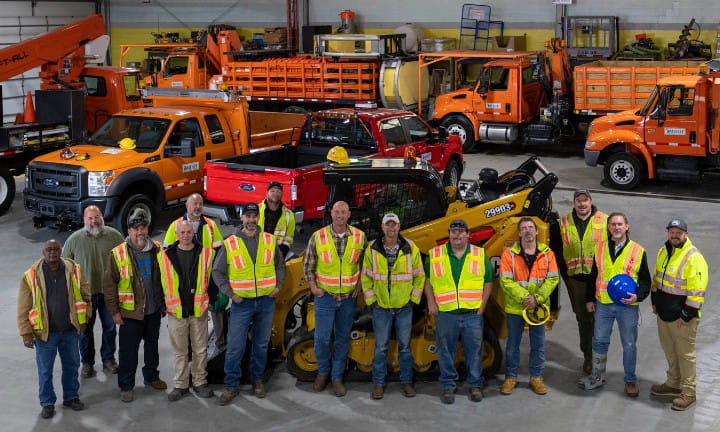 Grand Region Special Crews surrounded by MDOT trucks and maintenance vehicles.