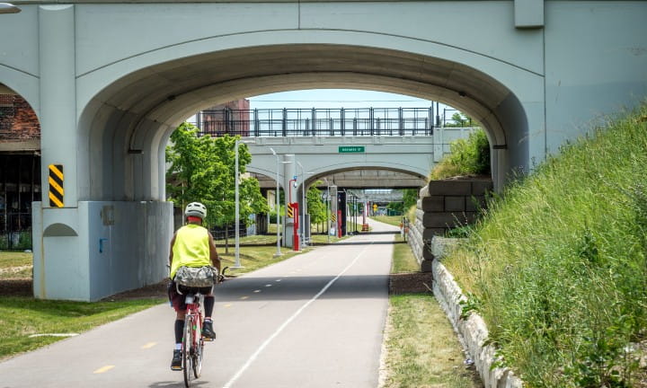 A bicyclist using the Dequindre Cut Greenway path in Detroit.
