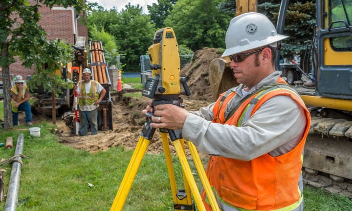 A contractor is surveying work in MDOT right of way.