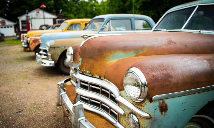 Old cars and trucks along M-26 in Houghton County.