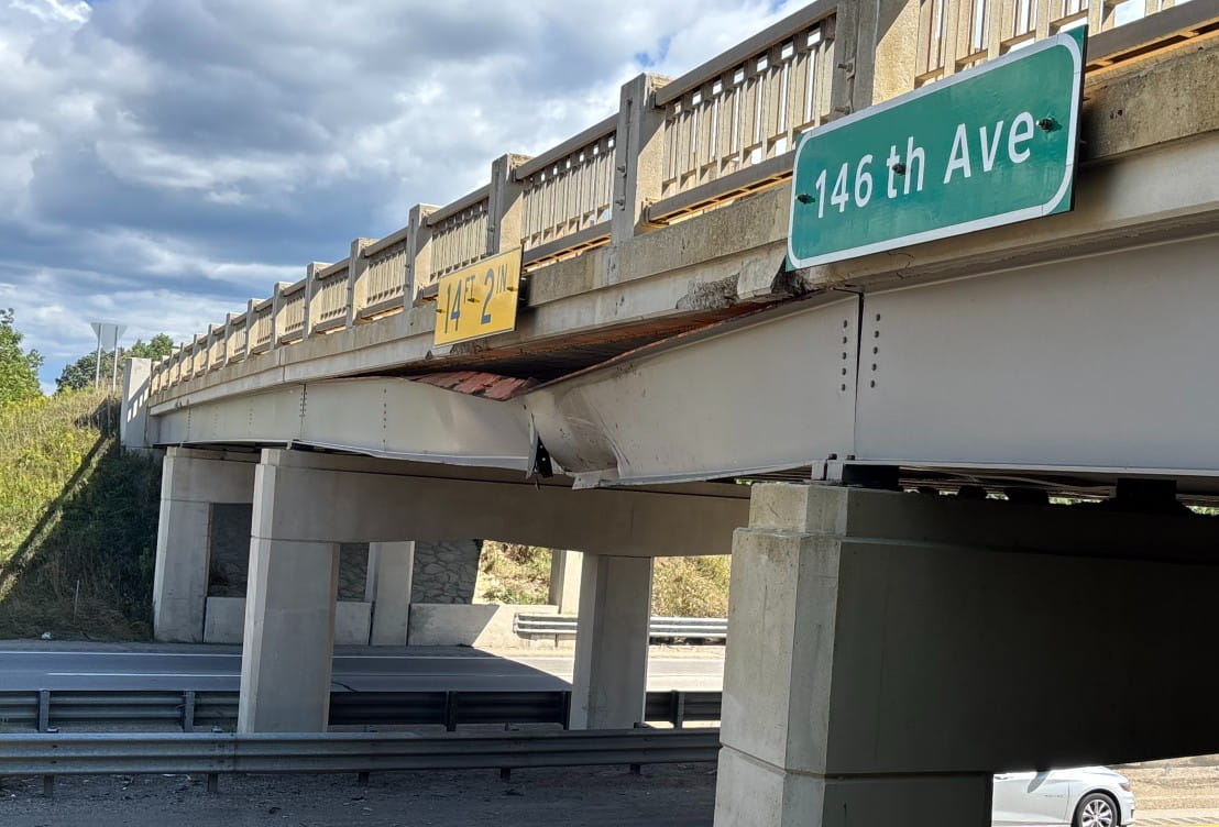 A bridge beam bent and split by an over height load at US-131 and 146th Street in Allegan County.