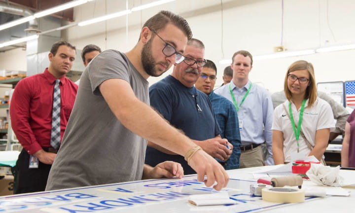 MDOT EDPs are shown how signs are created in MDOT's sign shop.