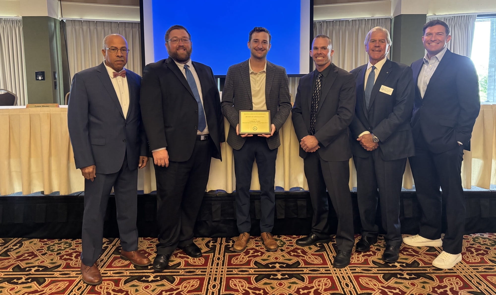From left to right: Dr. Brian Smith, MAC commissioner; Bryan Budds, MDOT Office of Aeronautics director; award recipient Charlie Tyson, technology activation director for MEDC's Office of Future Mobility and Electrification; Captain Greg Setla, Michigan State Police; Rick Fiddler, MAC commissioner; and Russell Kavalhuna, MAC vice chair. 