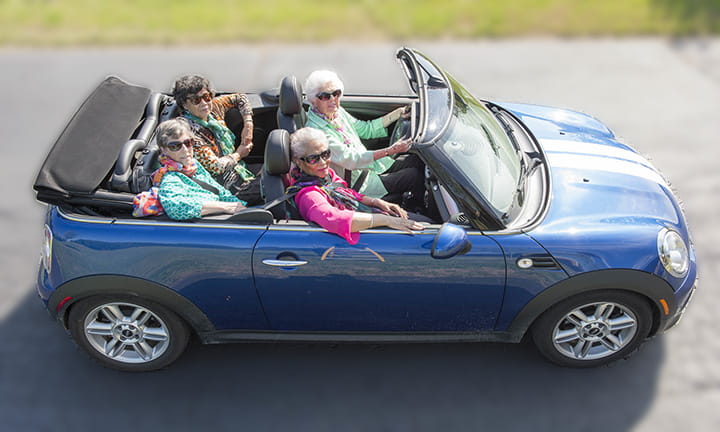 Four women travelling in a Mini Cooper
