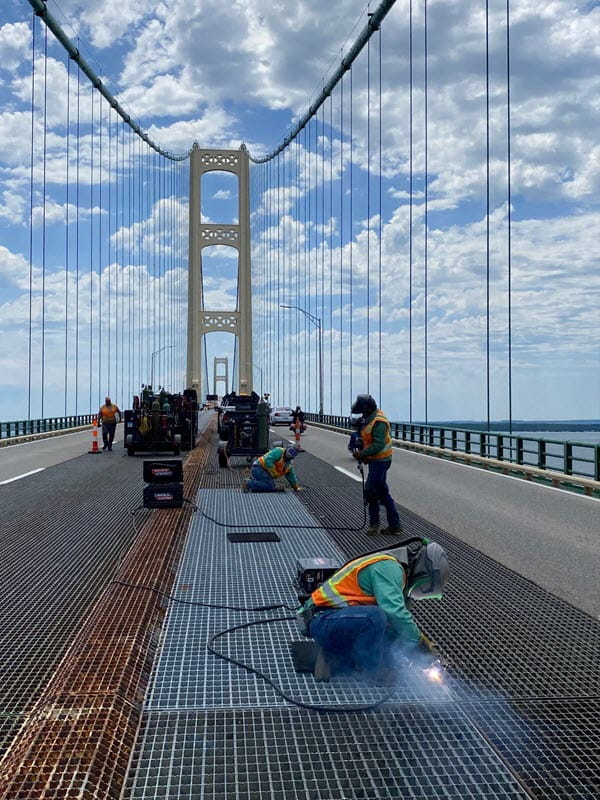 Mackinac Bridge crews performing bridge maintenance. 