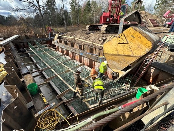 Crews pour one of the abutments for the Reynolds Road bridge in Benzie County earlier this year as part of the Michigan Department of Transportation (MDOT) local agency bridge bundling program. (Photo by OHM Advisors)