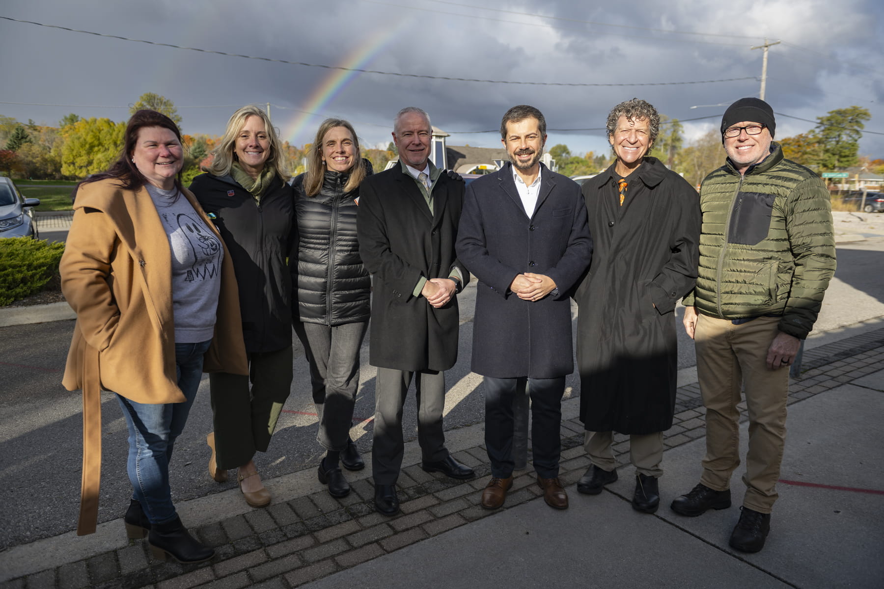 From left to right: Traverse City Mayor Amy Shamroe, Norte Executive Director Jill Sill, TART Trails Director Julie Clark, State Transportation Director Bradley C. Wieferich, former Secretary of Transportation Pete Buttigieg, Elmwood Township Supervisor Jeff Shaw, and Discovery Pier CEO Matt McDonough. 