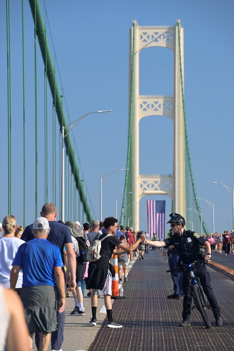 Participants in the 2025 Mackinac Bridge Walk head toward the middle of the bridge.