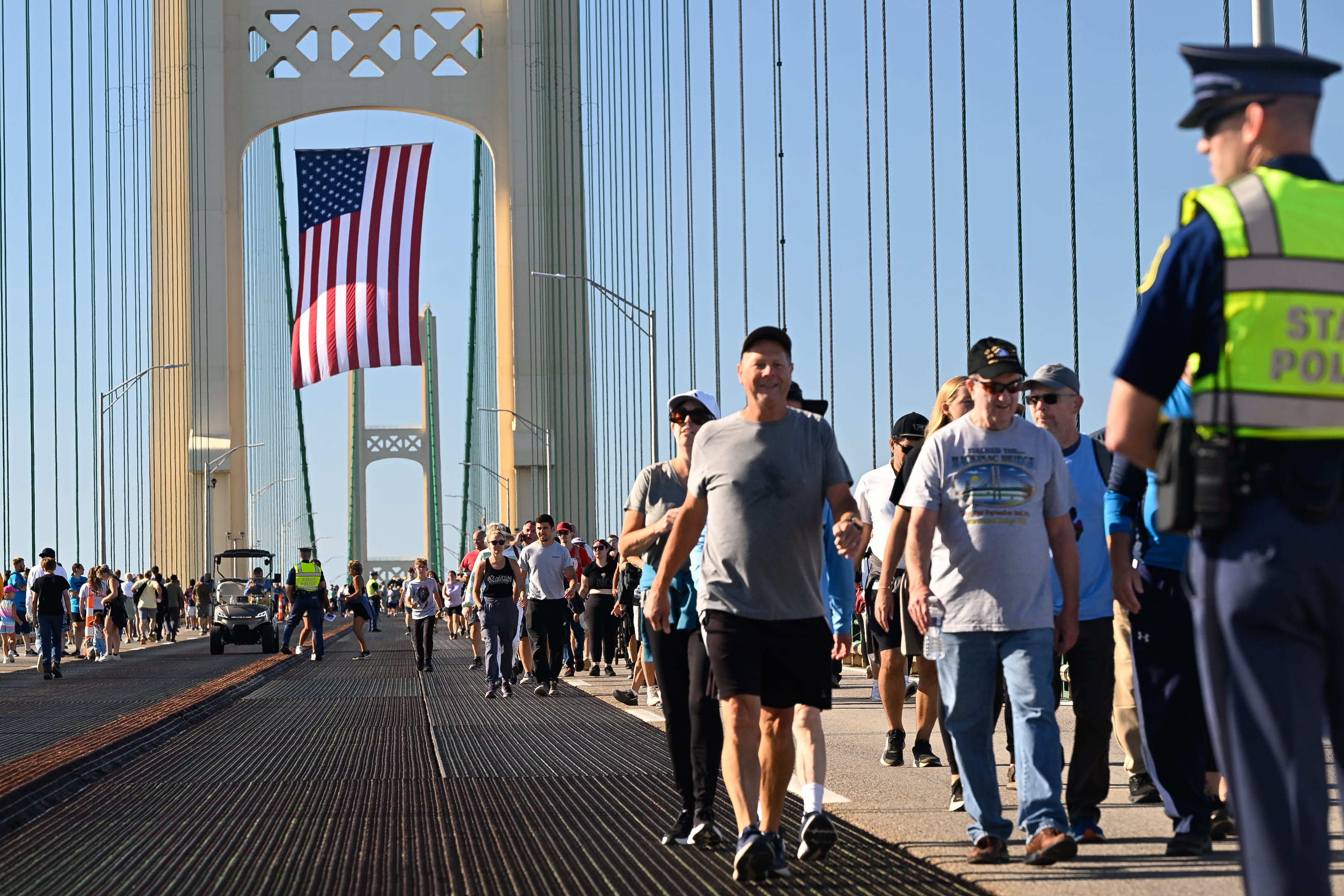 People walk in each direction past the north tower during the 2026 Mackinac Bridge Walk.