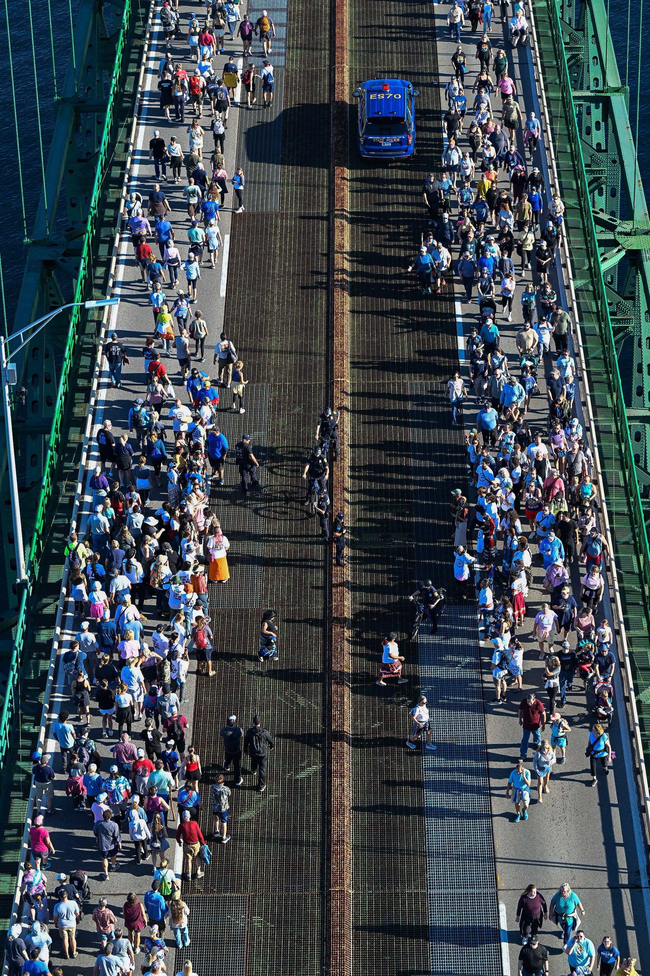 People walk in each direction past the north tower during the 2026 Mackinac Bridge Walk.