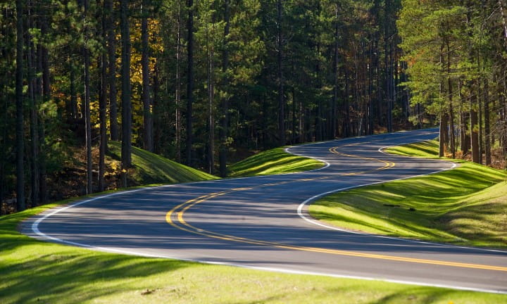 Winding road in Alger County through Pictured Rocks