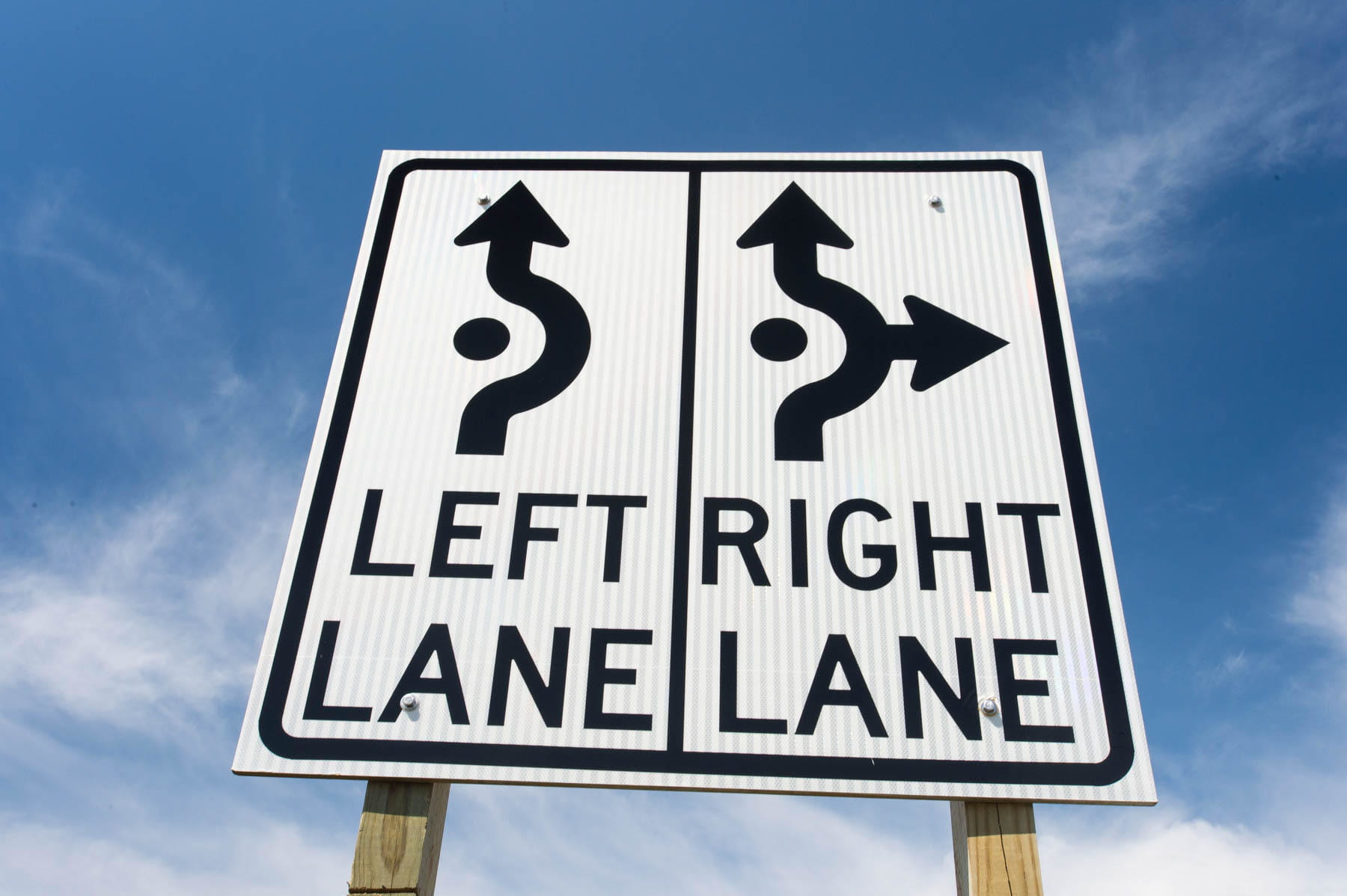 Roundabout sign showing direction for left lane and right lane.