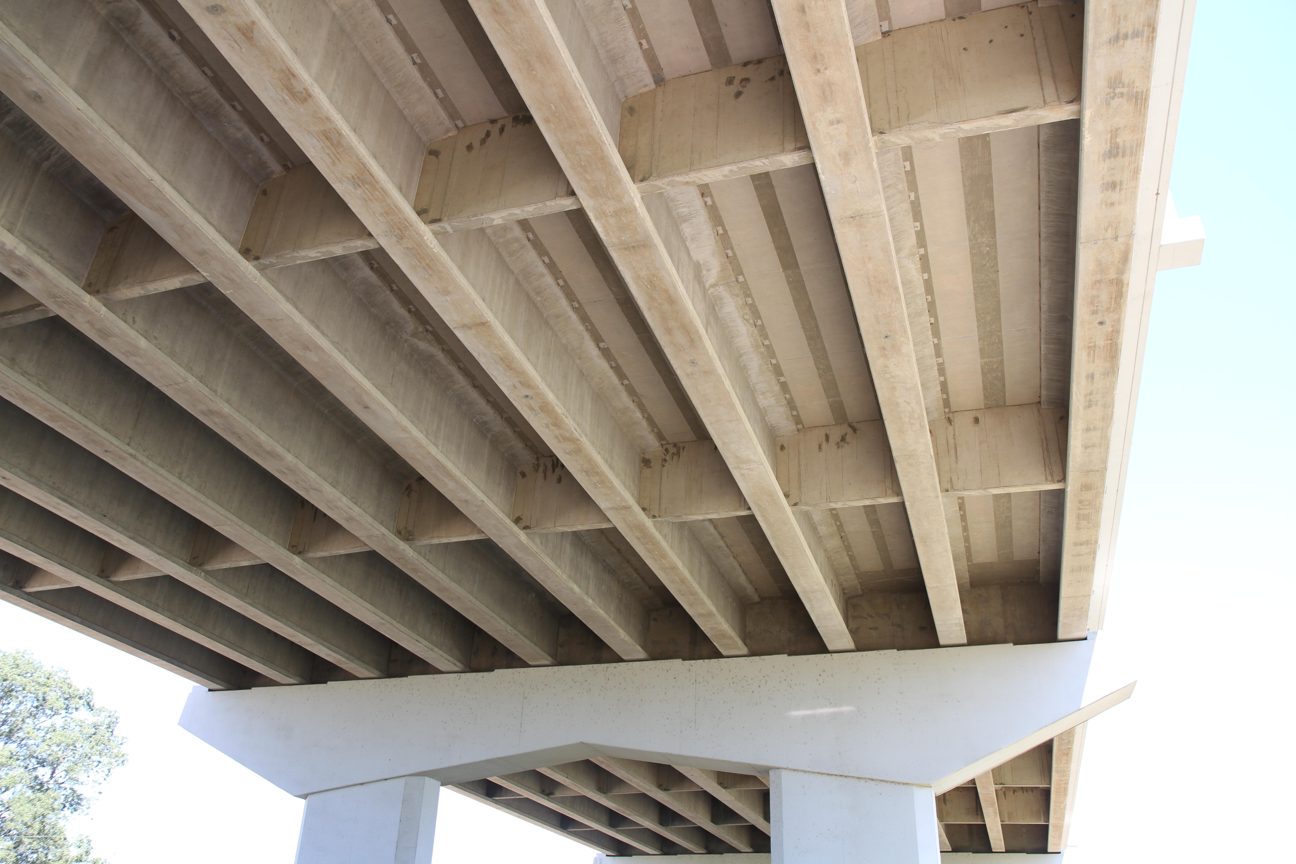 Diaphragms placed at intermediate locations (the members running left to right in this image) on the underside of a bridge.