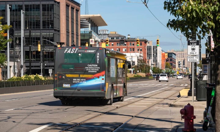 A Smartbus travels down a busy M-1 (Woodward Avenue) in Detroit.