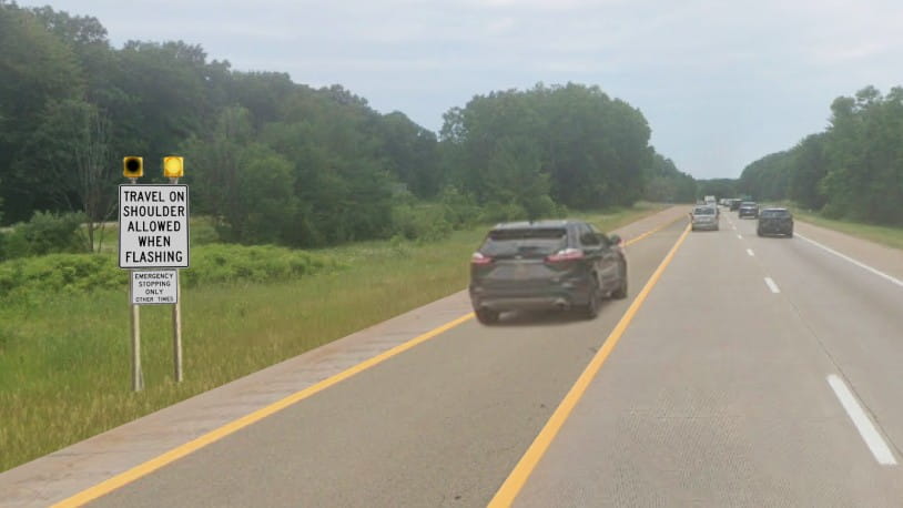 A flex route sign with the beacon turned on and flashing, so the lane is available for use.