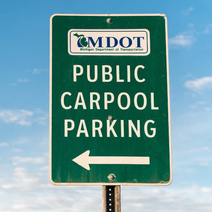 Green public carpool parking sign.