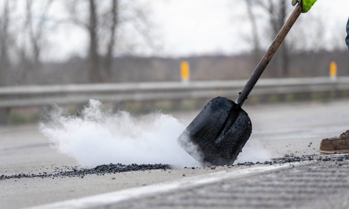 MDOT maintenance crews fill potholes with asphalt. 