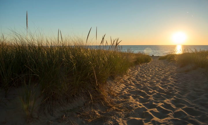 Sun setting on a Lake Michigan beach.