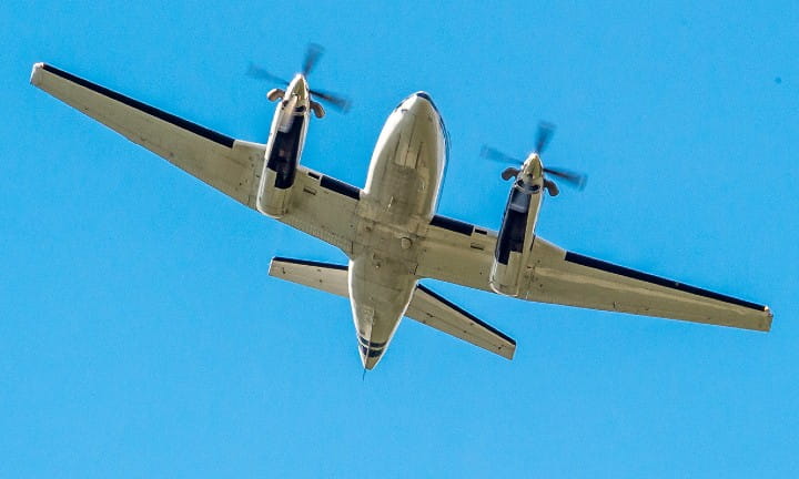 Airplane against a blue sky.