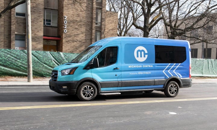A Michigan Central van powered by Electreon driving on a Detroit road.