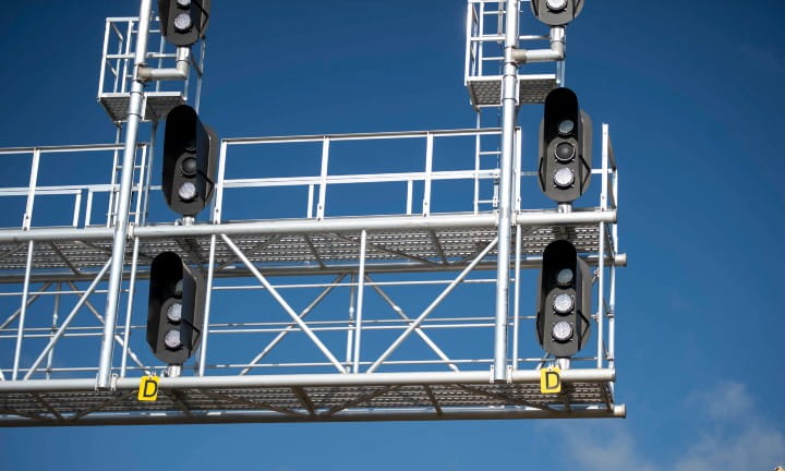 Double-stacked train crossing signals.