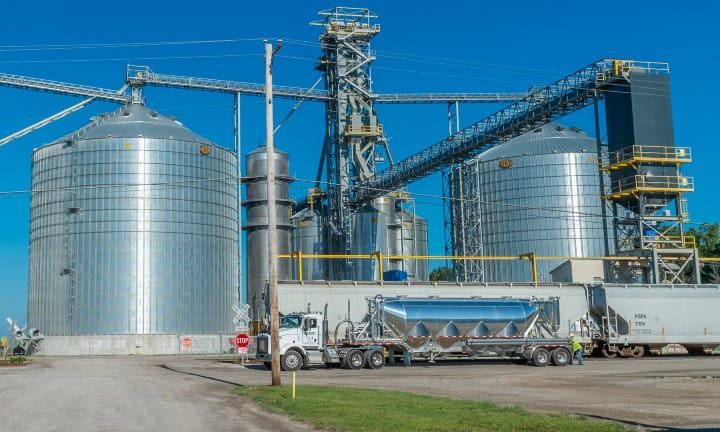 Rail cars near a grain elevator.