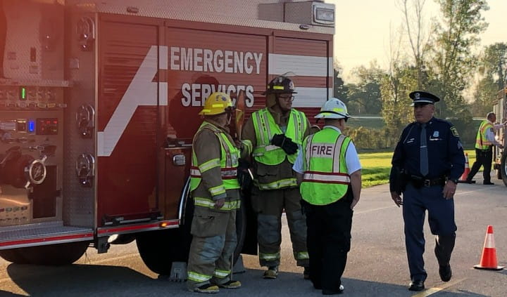 Police and fire first responders securing a crash scene.