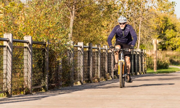 Bicyclist riding along a bike route.