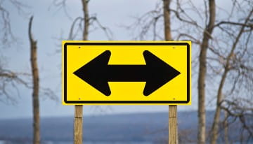 Highly reflective directional sign.