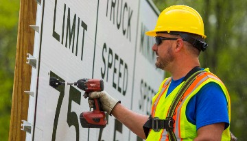 MDOT crews update signs to 75 mph in Clinton County.