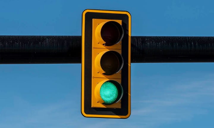 Traffic signals with backplates on M-59 in Macomb County.