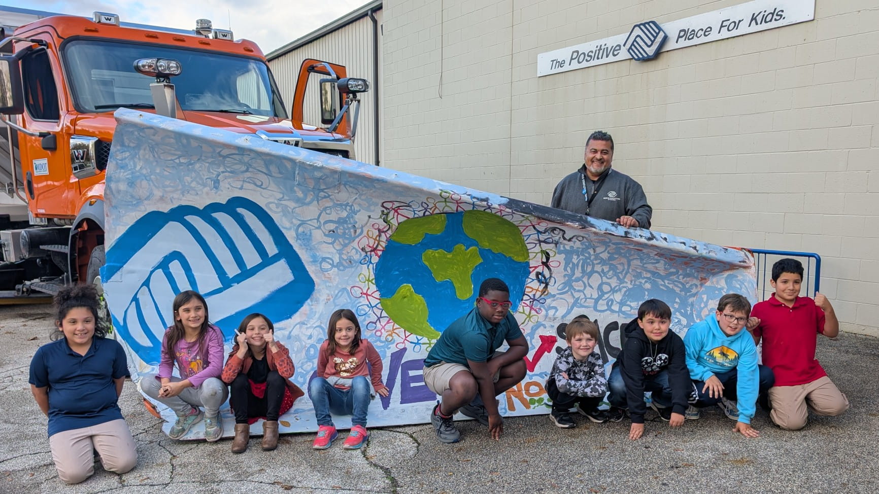 Bay City Boys and Girls Club students proudly unveiled their creative design for MDOT’s 2025-2026 Paint the Plow program.