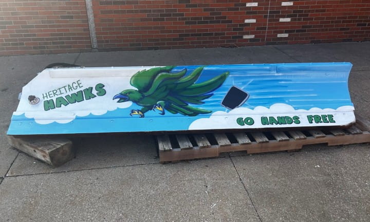 Heritage High School art students proudly unveiled their creative design for MDOT’s 2024-2025 Paint the Plow program.