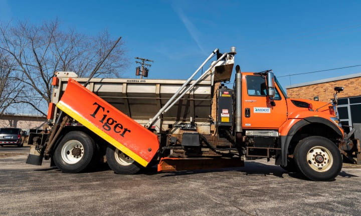 MDOT snowplow with the name Tiger on the plow blades.