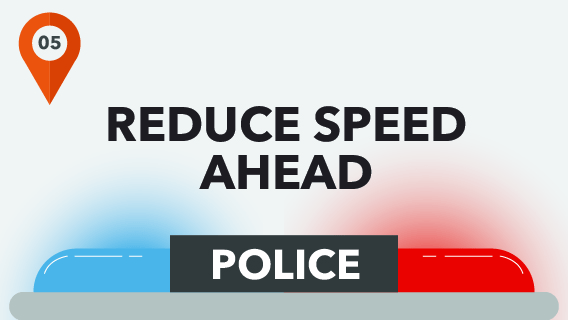 Reduce Speed Ahead with police car lights.