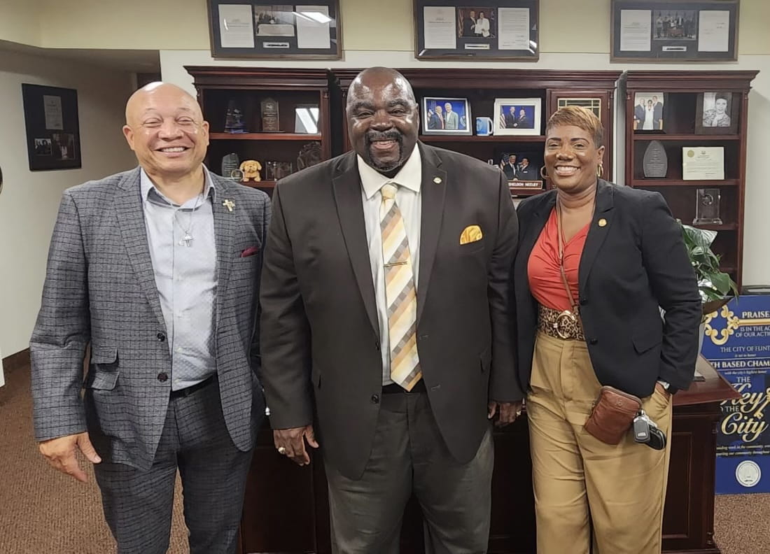 Flint Mayor Sheldon Neeley (left) and State Rep. Cynthia Neeley (right) recently met with Michigan Gaming Control Board Executive Director Henry Williams (center) in Flint to discuss efforts to combat illegal gaming in the city.