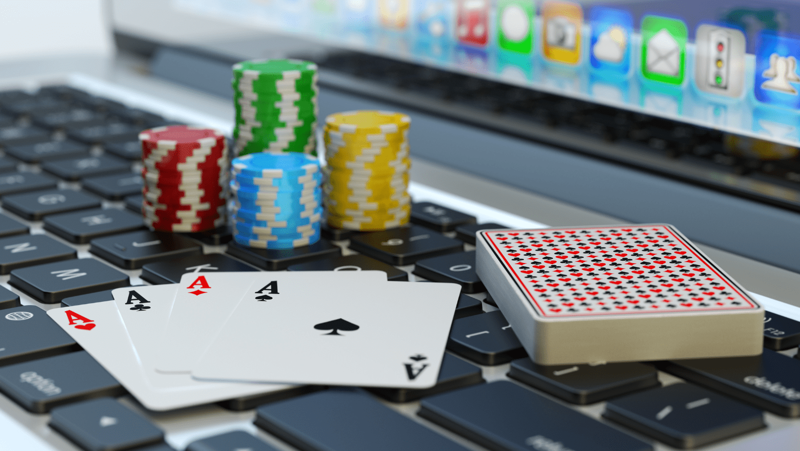 Laptop with cards and poker chips