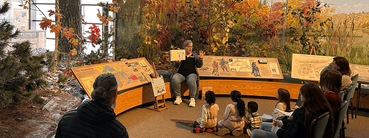 A woman reading to children.