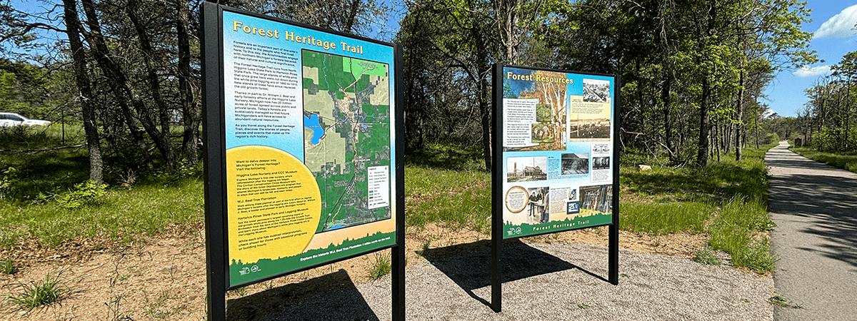 Two heritage trail signs.