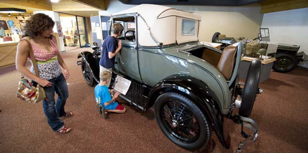 Auto exhibit inside the Michigan Iron Industry Museum, shows jeep and Ford